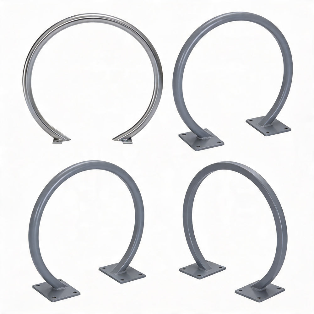 Four metallic bike rack hooks on a white background