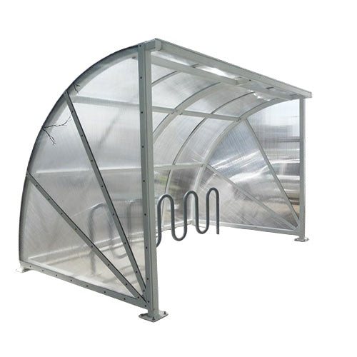 A bike shelter with a transparent roof and metal frame, equipped with bike racks.