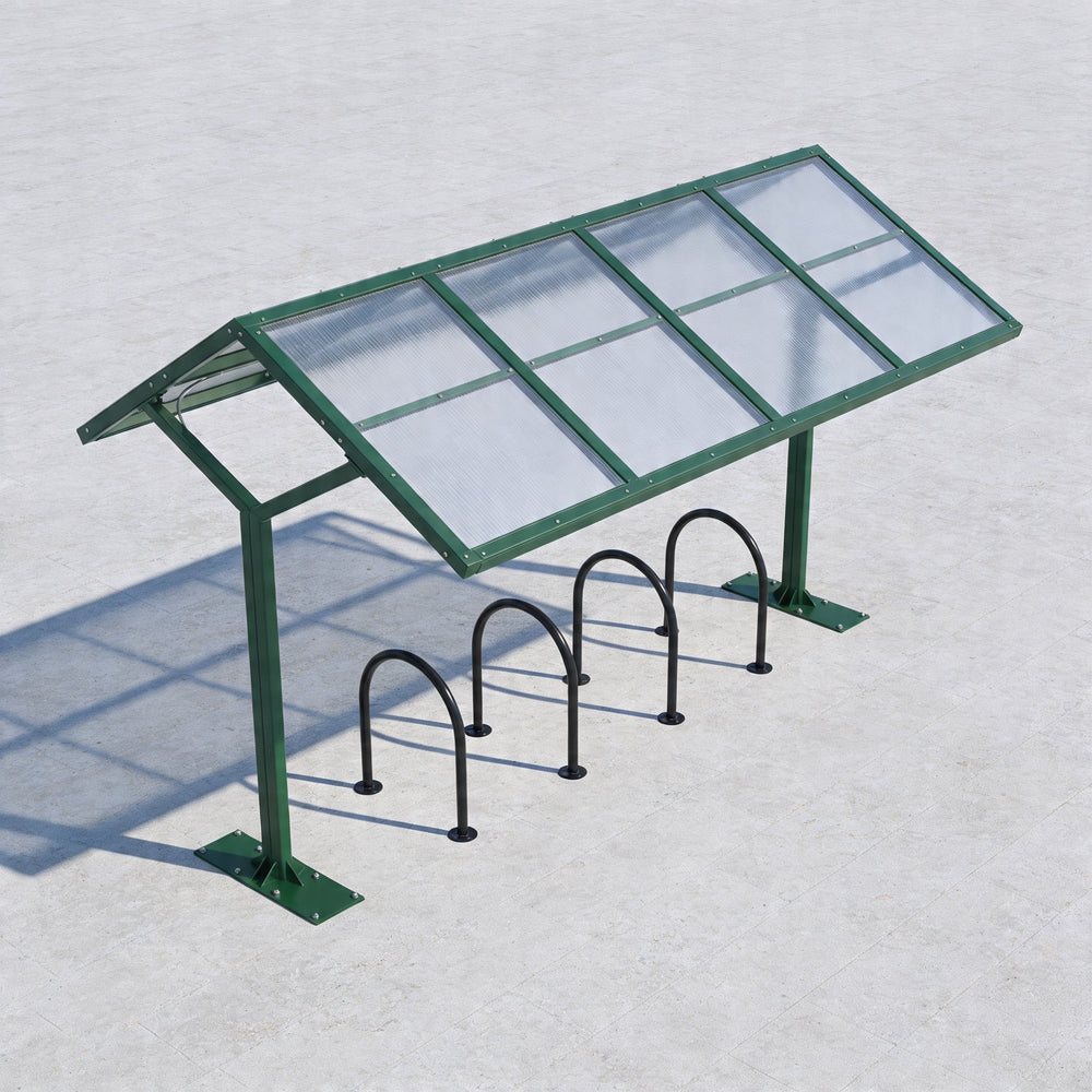 Bicycle shelter with glass panels and metal bike racks on a light gray background