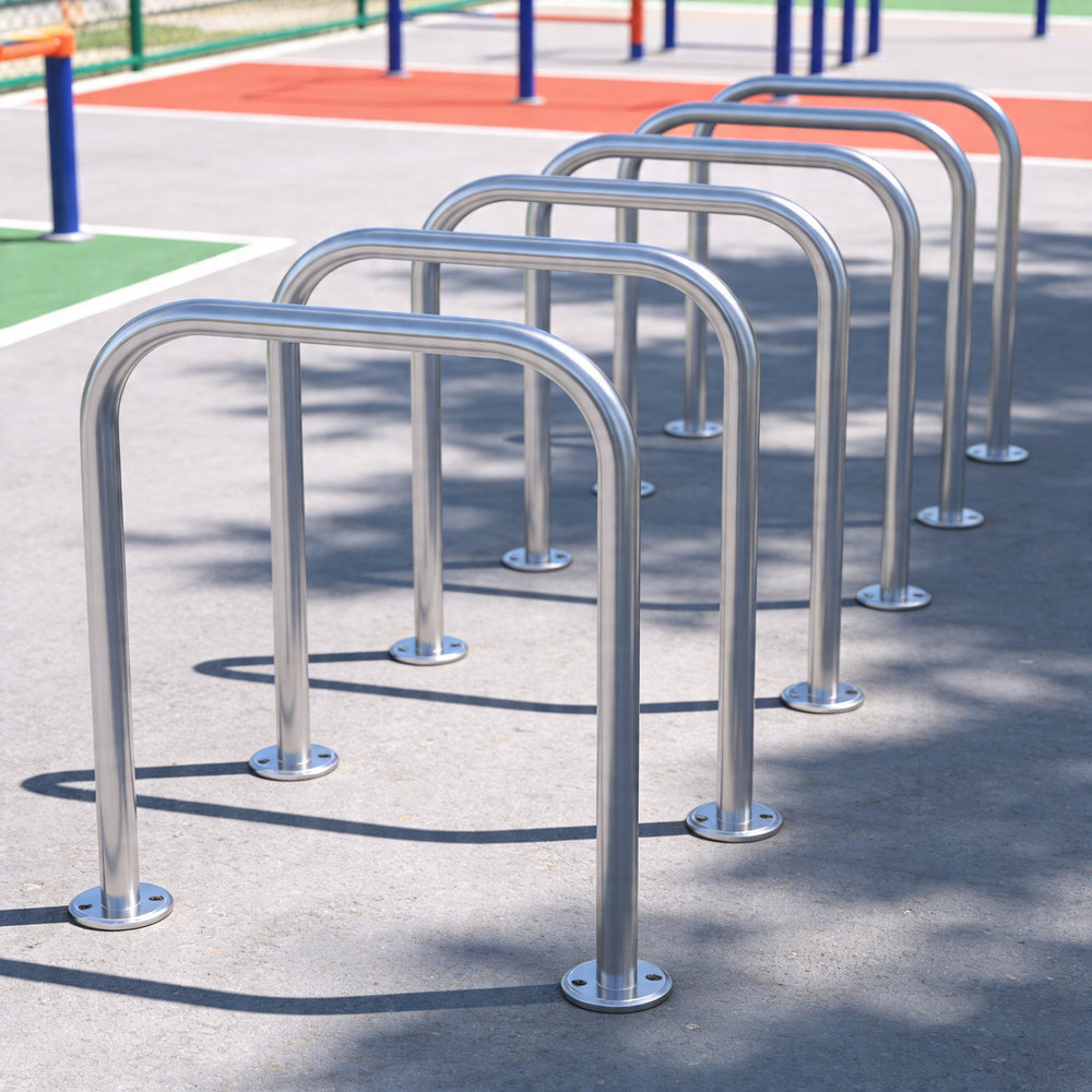 Row of metal bike racks on a concrete surface