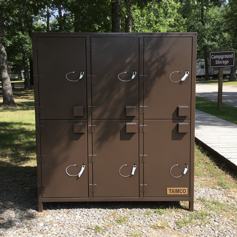 Brown storage lockers with multiple doors in a park-like setting