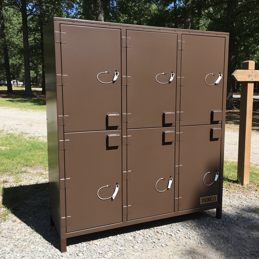 Brown metal lockers with multiple doors in an outdoor setting