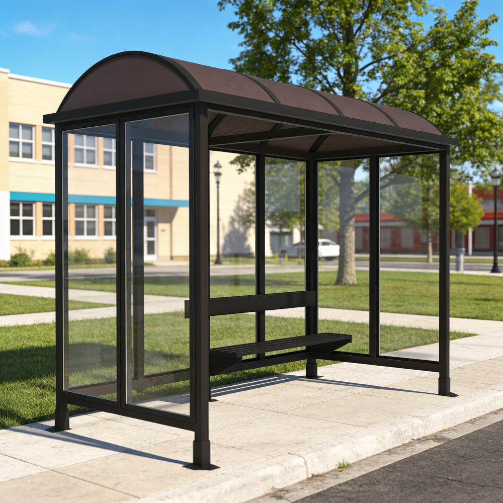 Bus shelter on a sidewalk with a clear view of the street and buildings in the background.