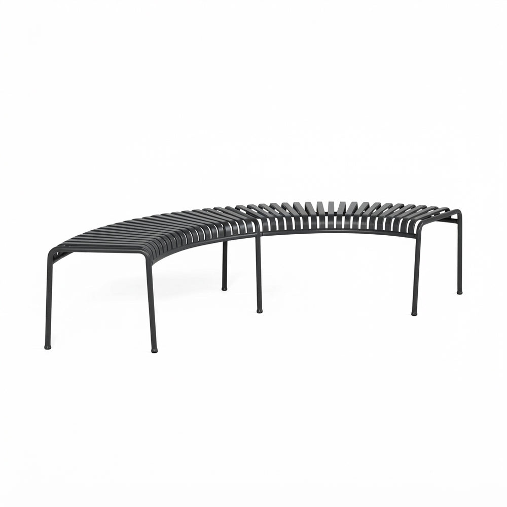 A curved outdoor slatted bench in matte black metal, shown from a three-quarters angle on a solid white background.