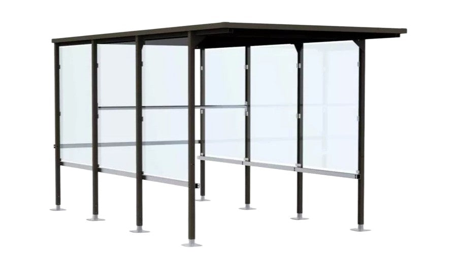 TAIMCO shopping cart shelter installed outdoors with flat roof and glass side panels for retail cart storage.