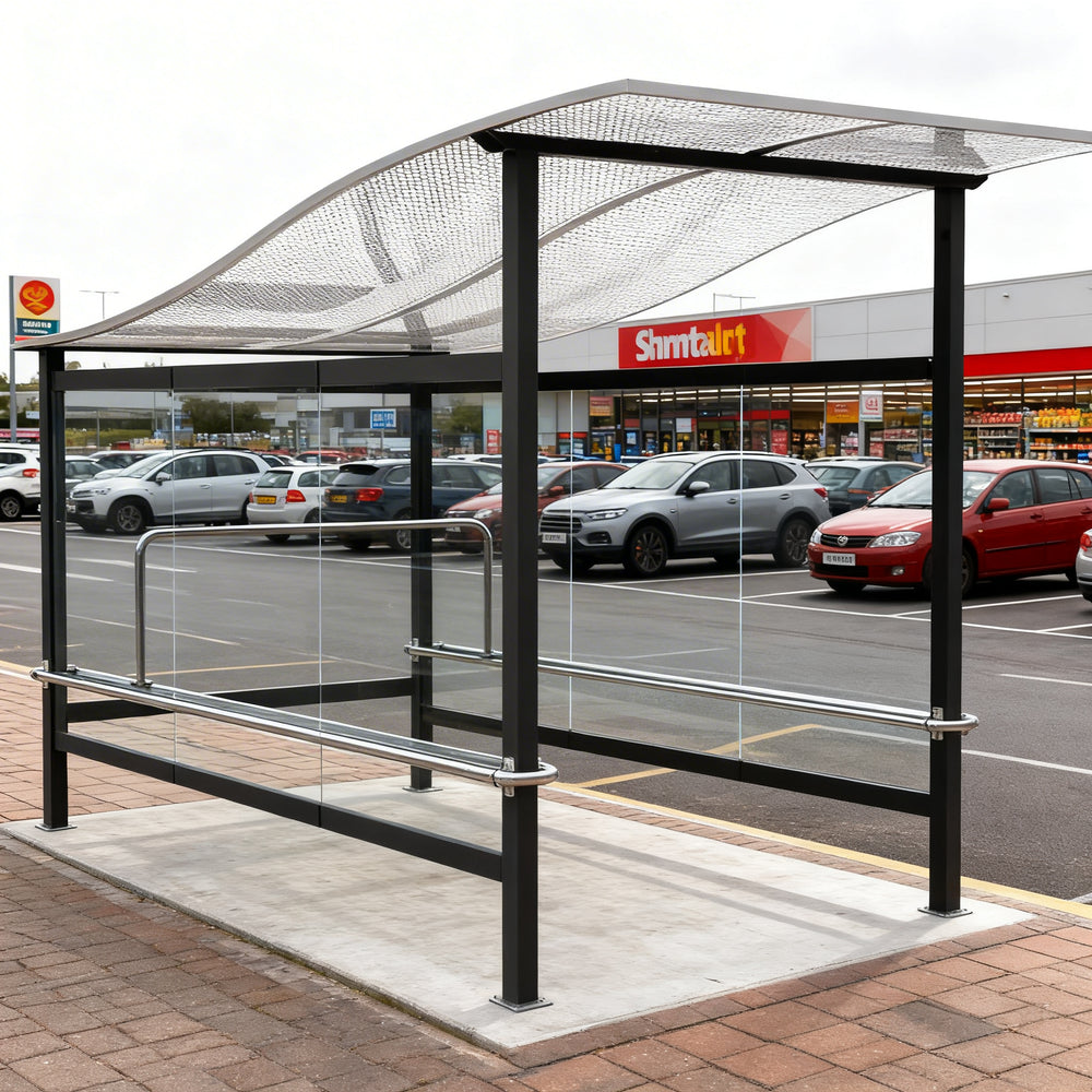 Rear angle of shopping cart shelter with curved roof and full glass back panel.