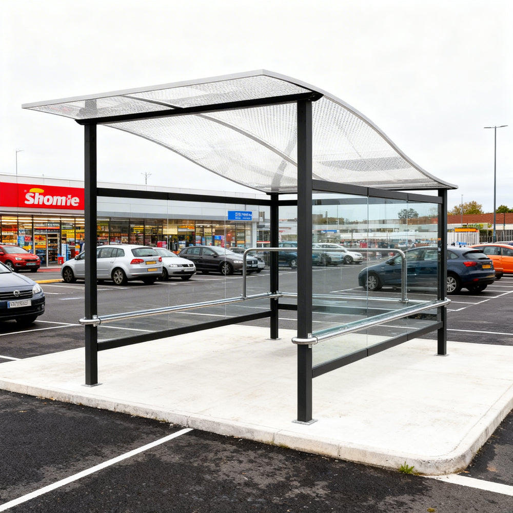 TAIMCO shopping cart shelter installed outdoors with wavy roof and glass side panels for retail cart storage.