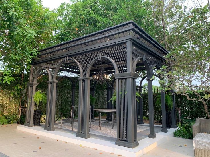 Top‑down angle showing pergola roof frame and ornamental perimeter.