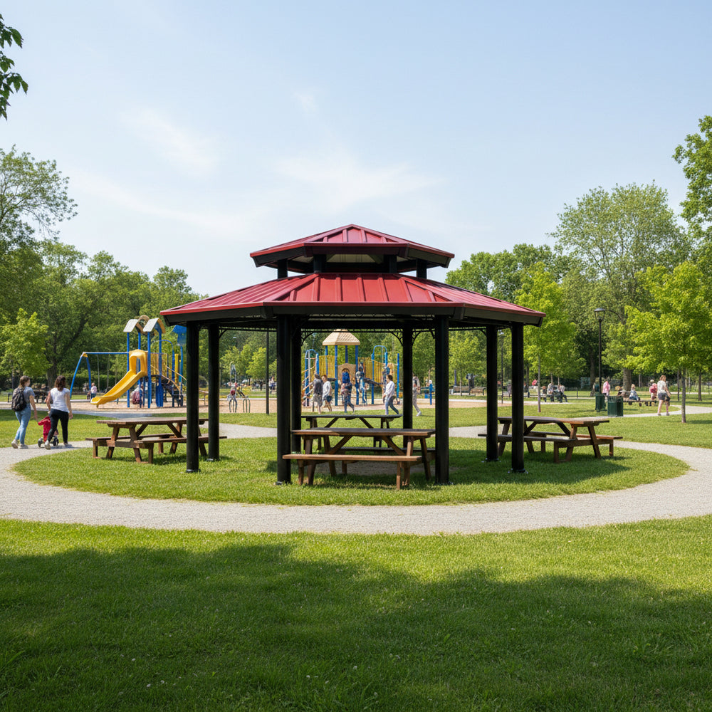 Gazebo with picnic tables in a park setting with playground equipment and trees.