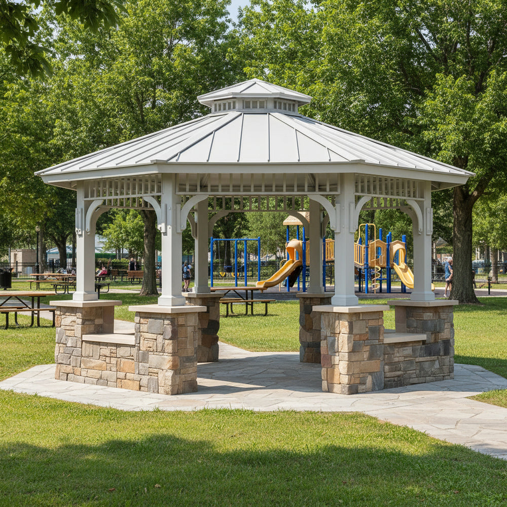 Gazebo with stone base in a park with playground equipment in the background