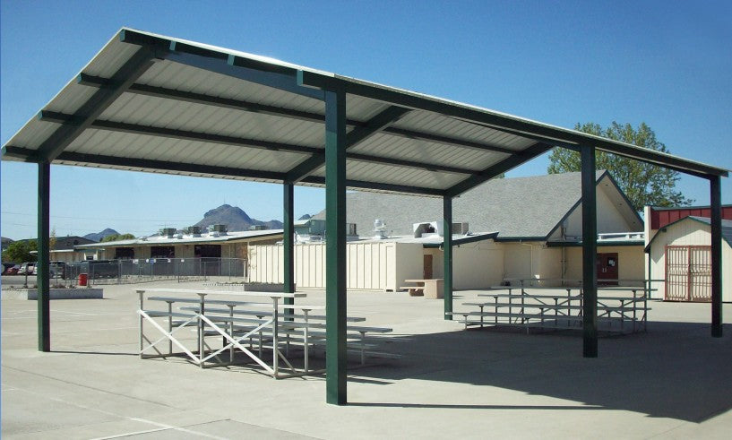 Outdoor architectural shelter with red metal roof and rectangular steel frame