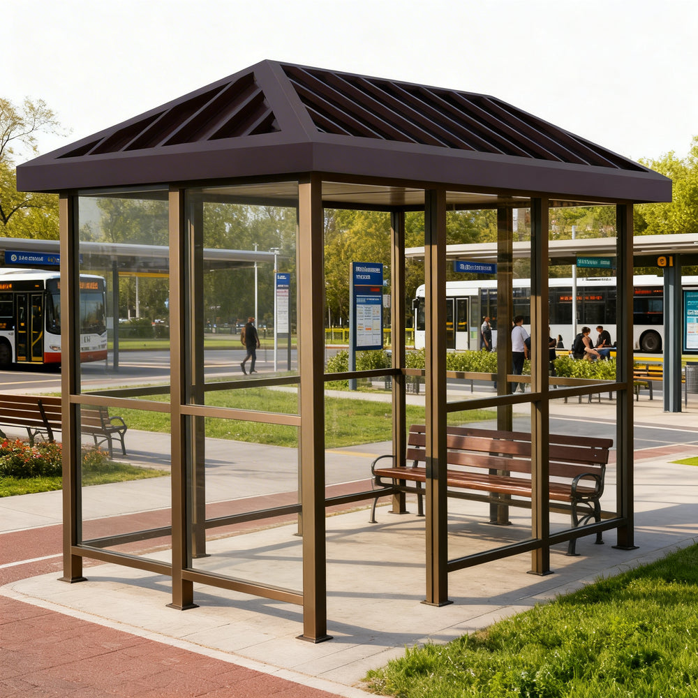 Empty modern bus stop shelter with slanted roof and glass enclosure designed for public transportation stops.