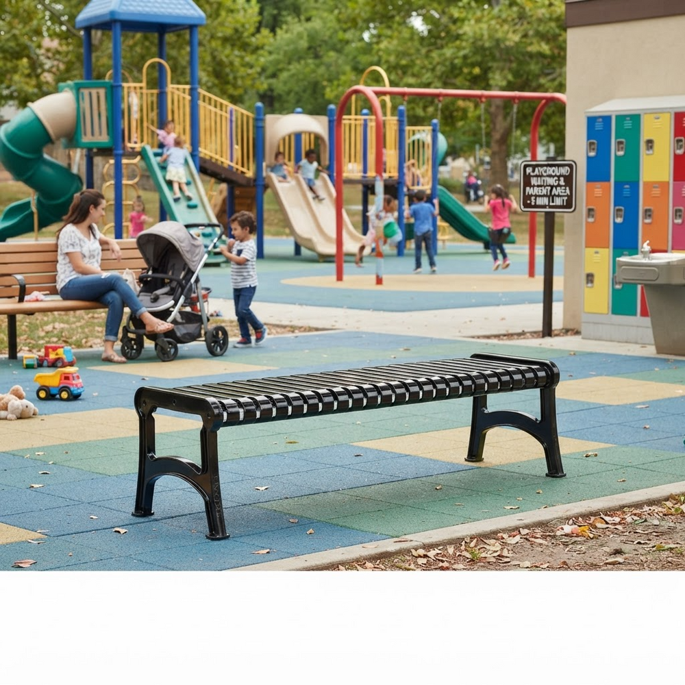 A black slatted park bench in the foreground at a children's playground, with kids, a stroller, colorful play structures, and a playground sign in the background.