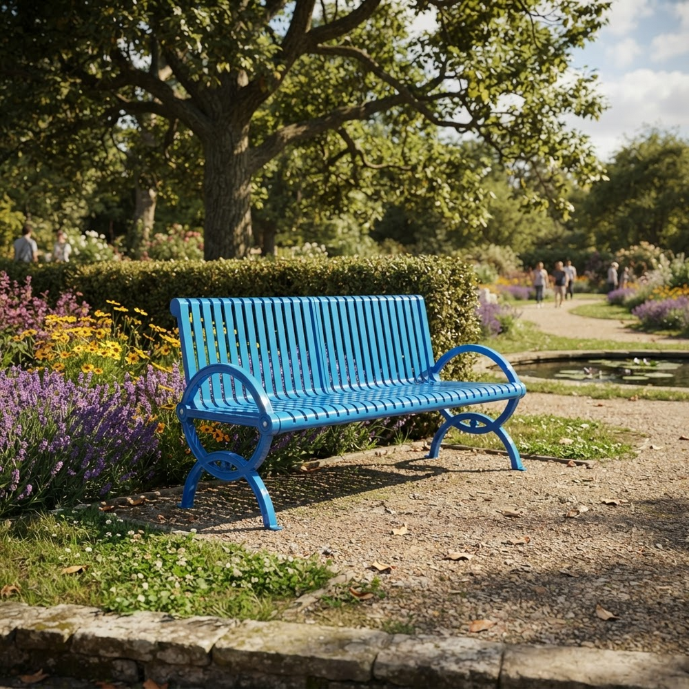 A bright blue slatted park bench sits on a gravel path in a landscaped garden with trees, flowers, and distant people walking along a path.