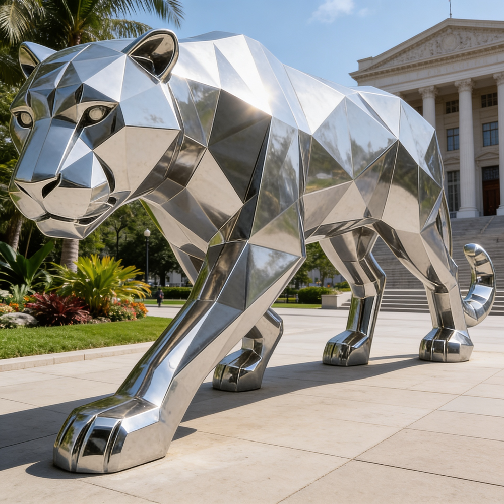 Polished metal panther statue with abstract faceted design and smooth reflective planes