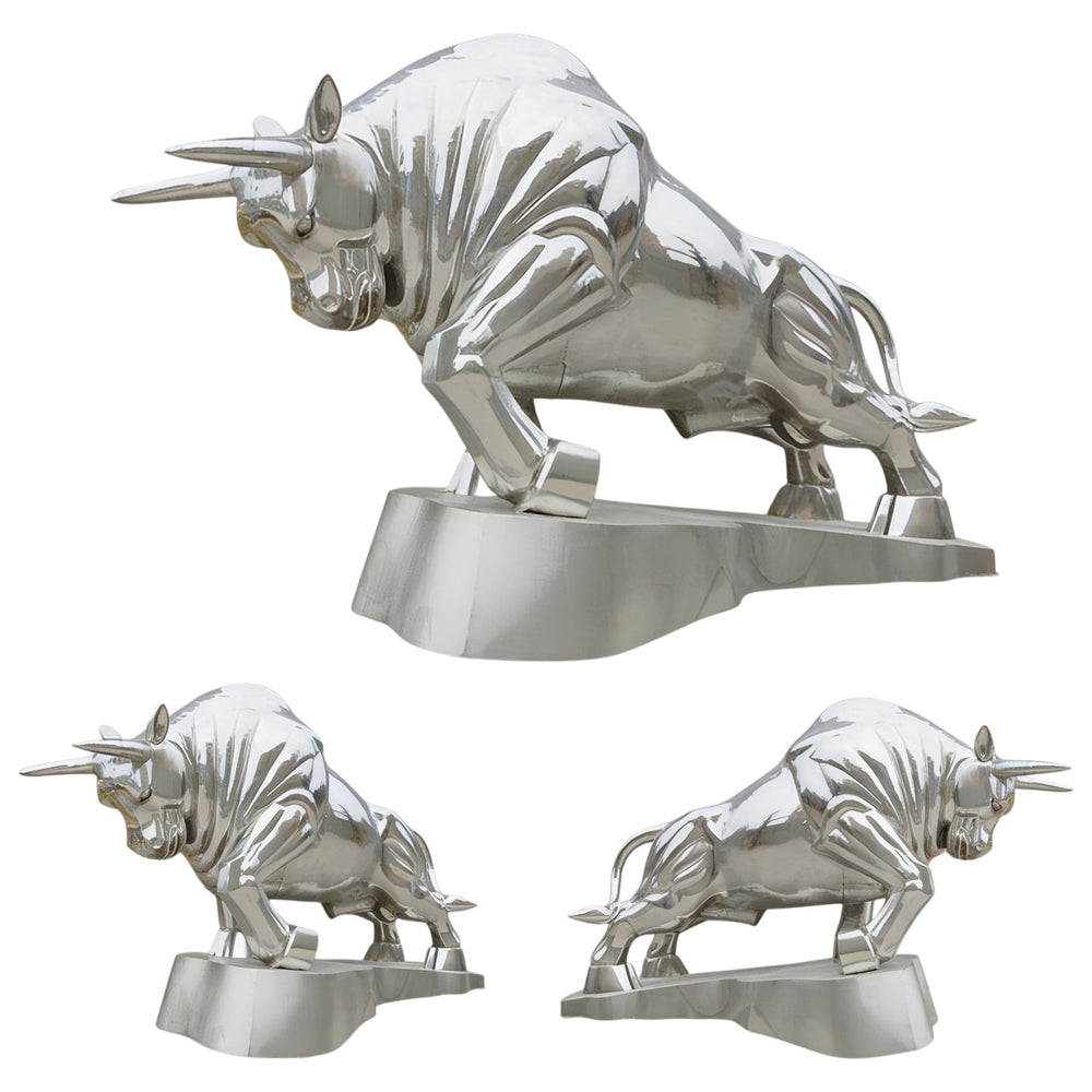 Set of three silver bull statues on a white background
Metal charging bull sculpture mounted on a matching base.