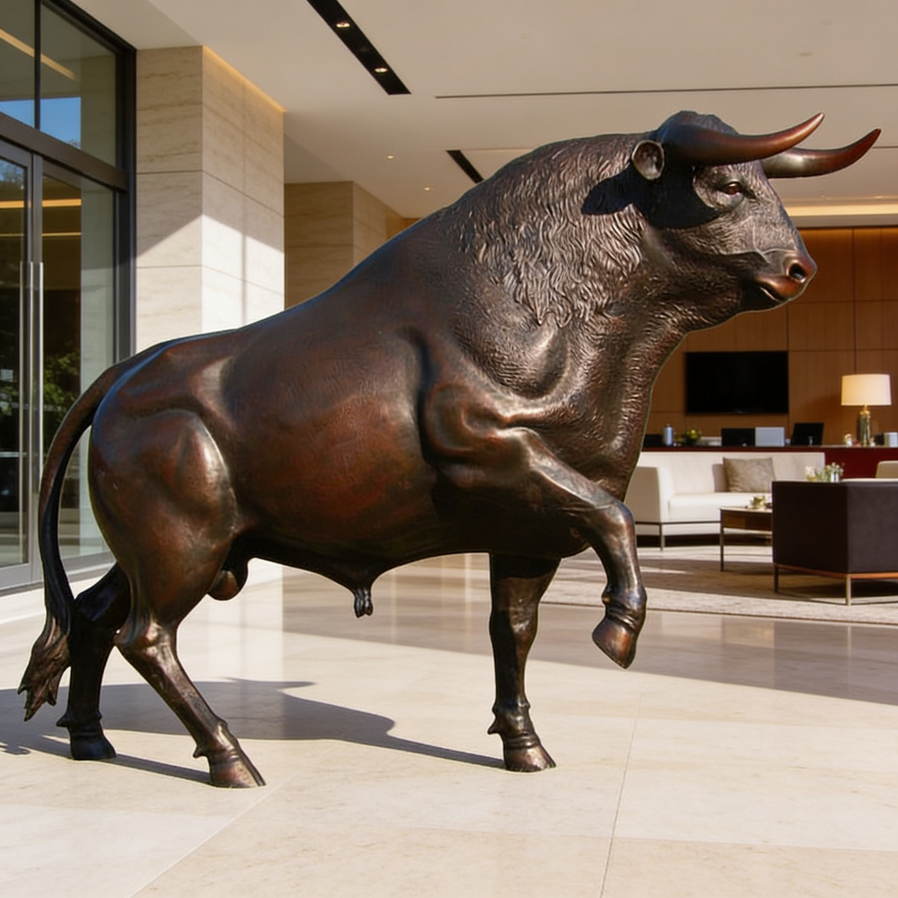 Bronze bull statue in a modern indoor setting
Bronze bull statue in a powerful forward‑leaning stance