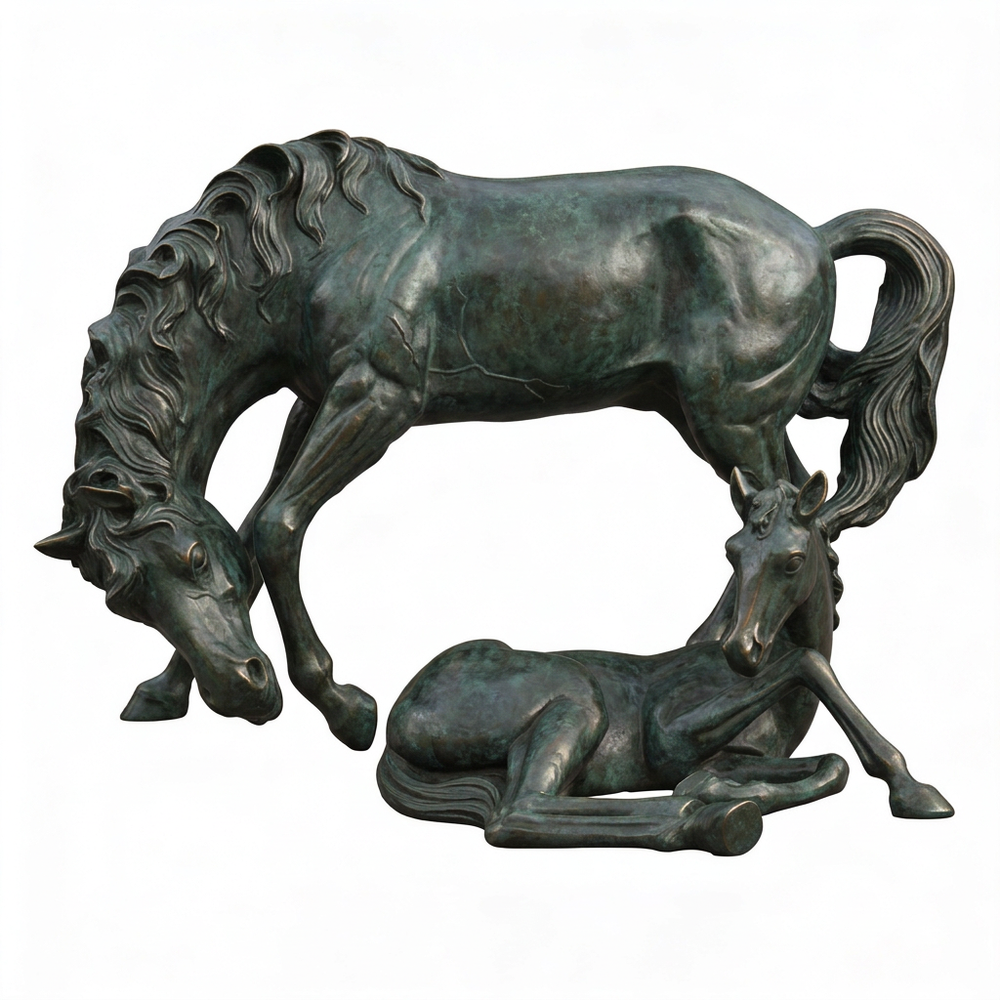 Bronze sculpture of two horses, one standing and one lying down, on a white background.
