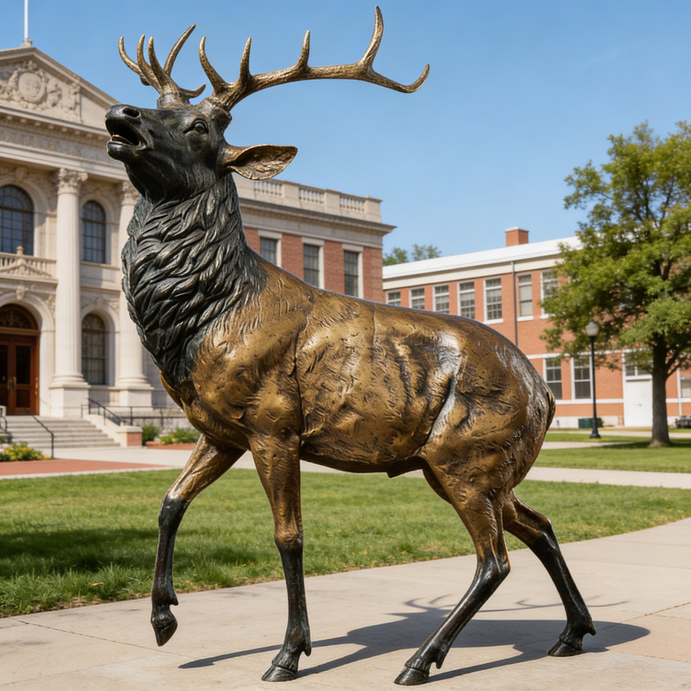 Bronze deer sculpture with golden body tones, dark legs, and intricately crafted antlers