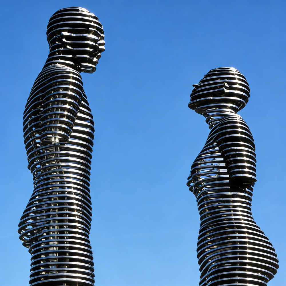 Reflective metallic artwork featuring ring‑layer human silhouettes facing each other