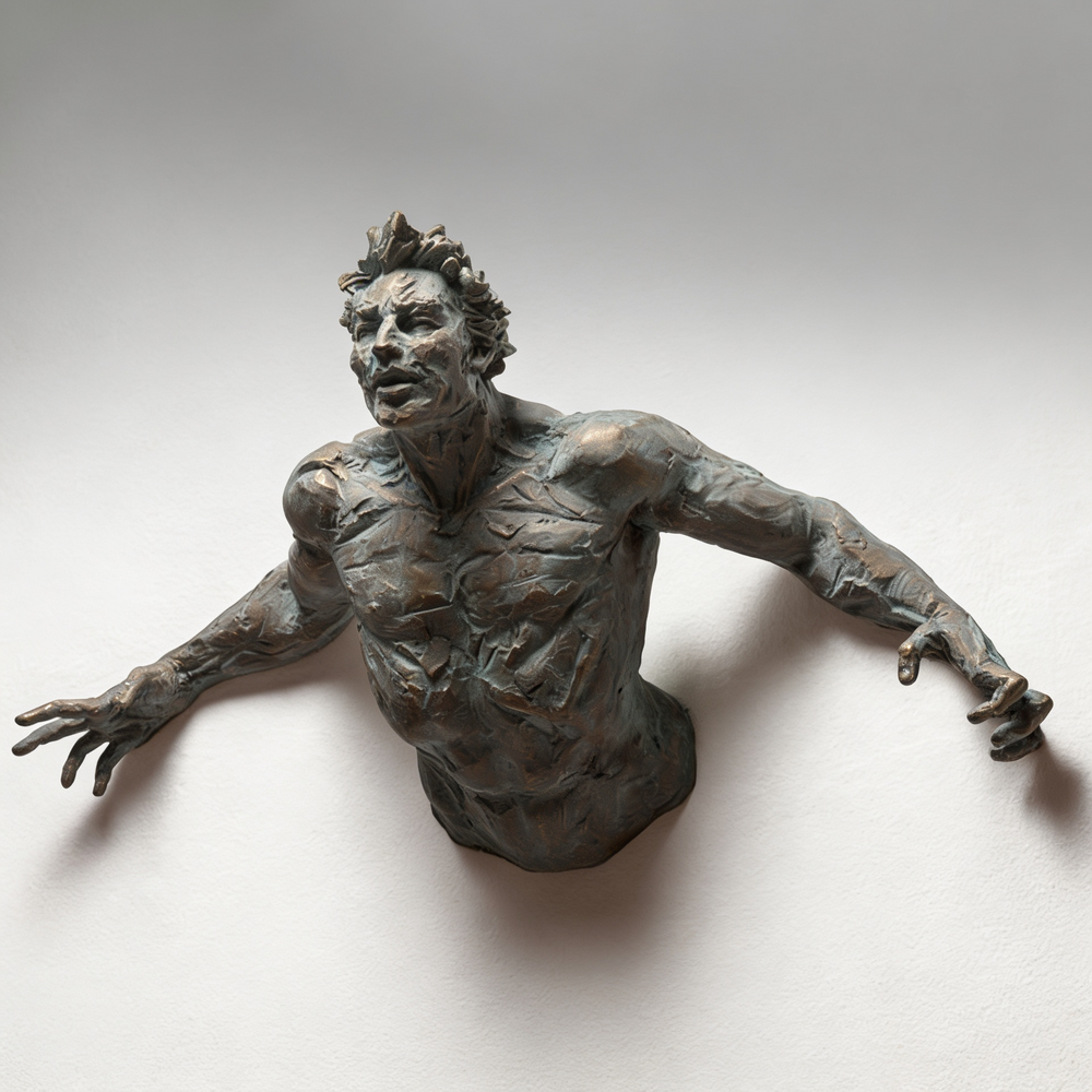 Bronze sculpture of a figure on a white background