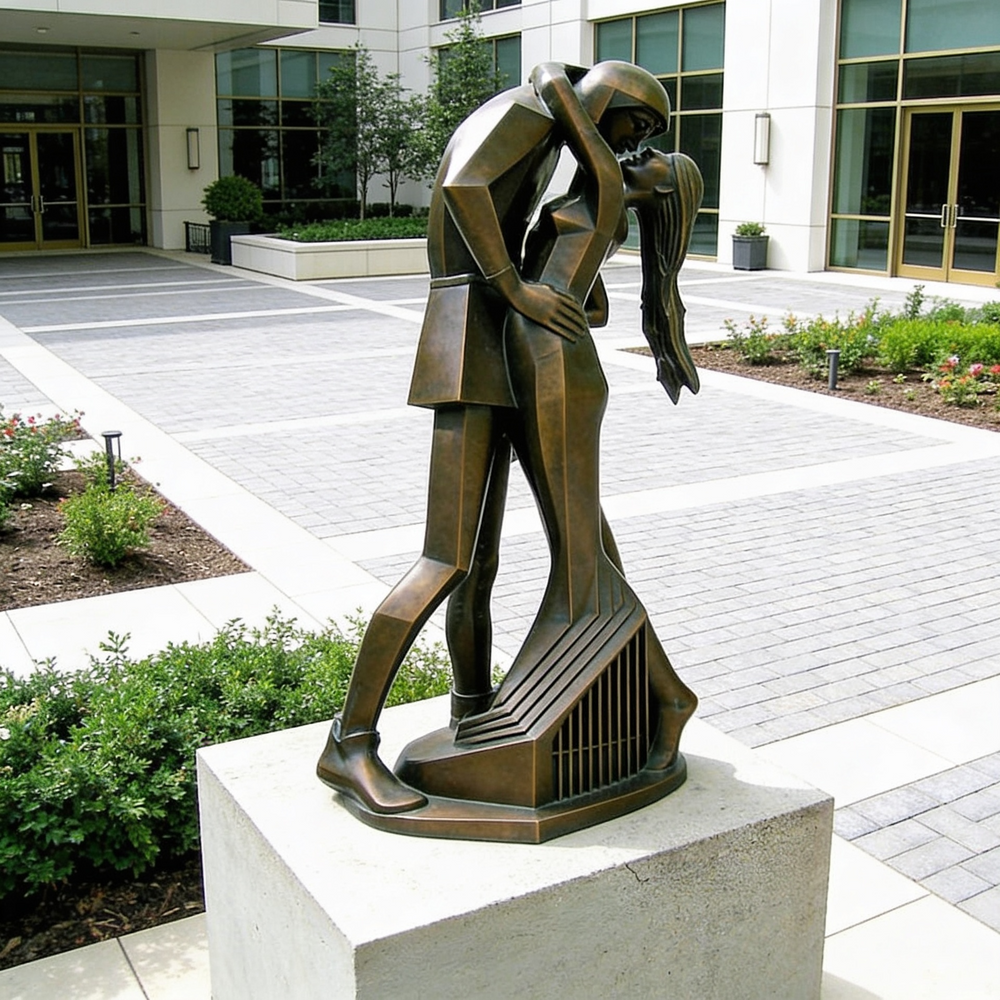 Bronze sculpture of a couple embracing in front of a building