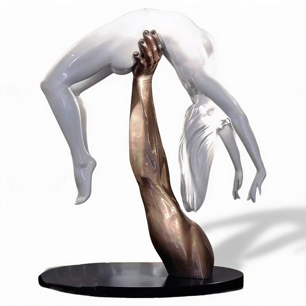 Contemporary mixed‑tone sculpture featuring a bronze arm and a suspended white human form