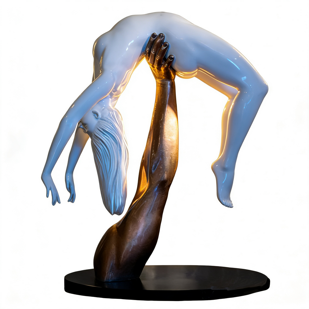 Bronze and white two‑tone sculpture depicting a raised arm lifting a gracefully arched human figure