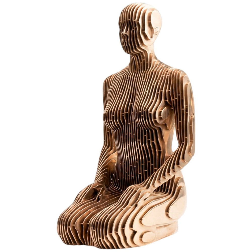 Wooden sculpture of a seated figure on a white background