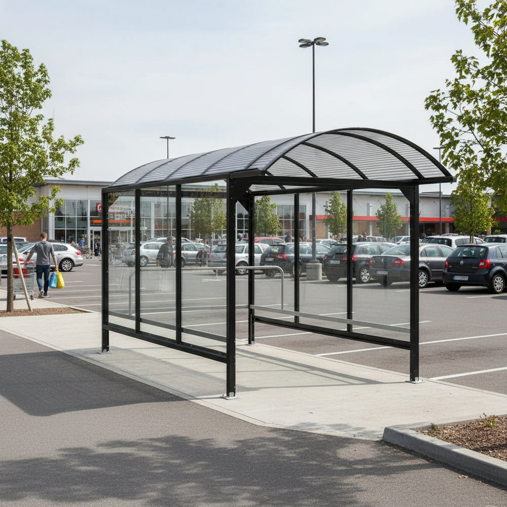 Interior of shopping cart shelter showing steel railing system and weather‑protected polycarbonate enclosure.