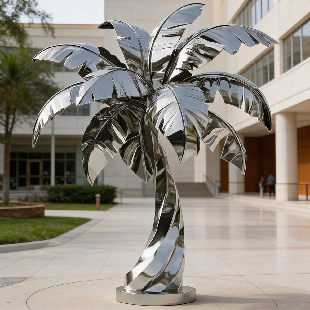 Reflective metal palm tree sculpture with smooth curved leaves and a spiral‑shaped trunk