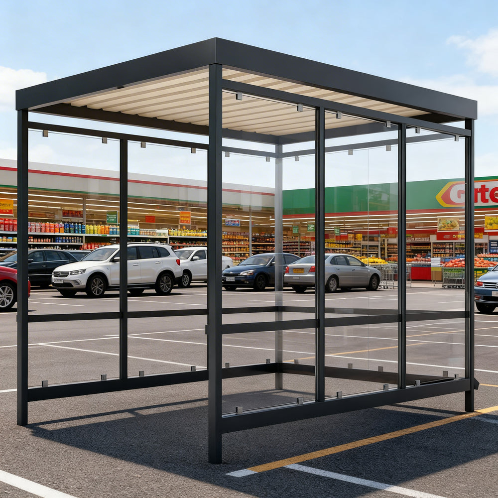 Side profile of modern shopping cart shelter featuring flat roof design and transparent glass enclosure.