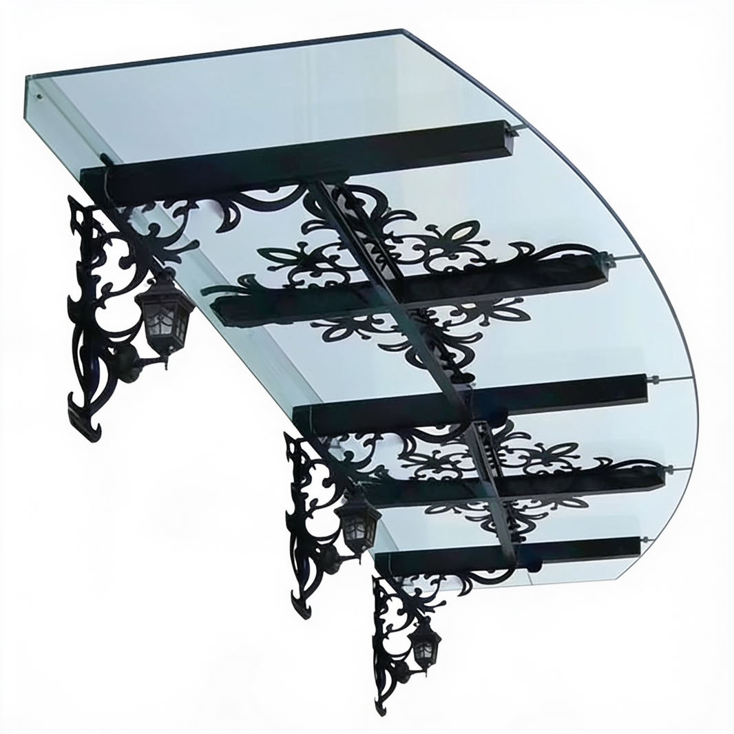 Curved glass outdoor awning with floral wrought iron scrollwork and dual lanterns.