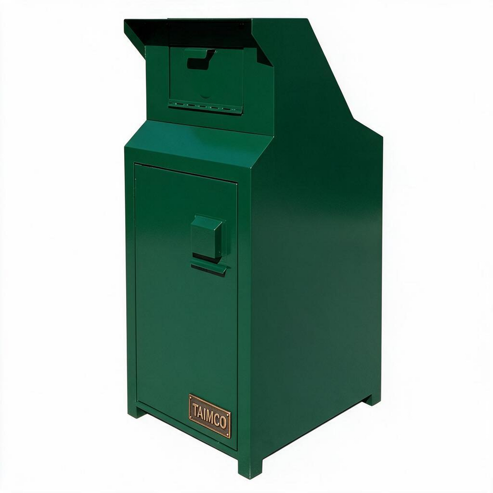 A dark green metal safe or deposit box with a hinged top lid, a front door handle, and a small 'TAMCO' brand plate near the bottom, shown on a plain white background.