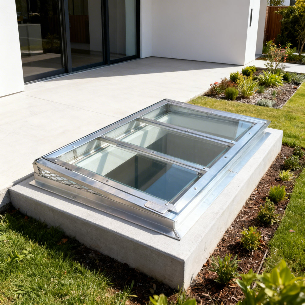 Glass rooflight on a concrete base with a modern building in the background