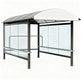 TAIMCO shopping cart shelter with curved translucent roof and full glass side panels.