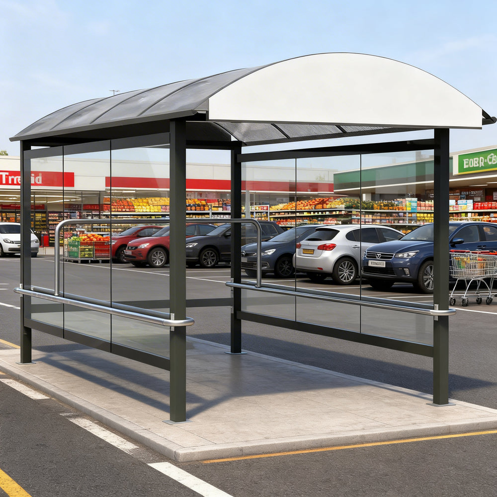 Side profile of modern shopping cart shelter featuring curved roof design and transparent glass enclosure.