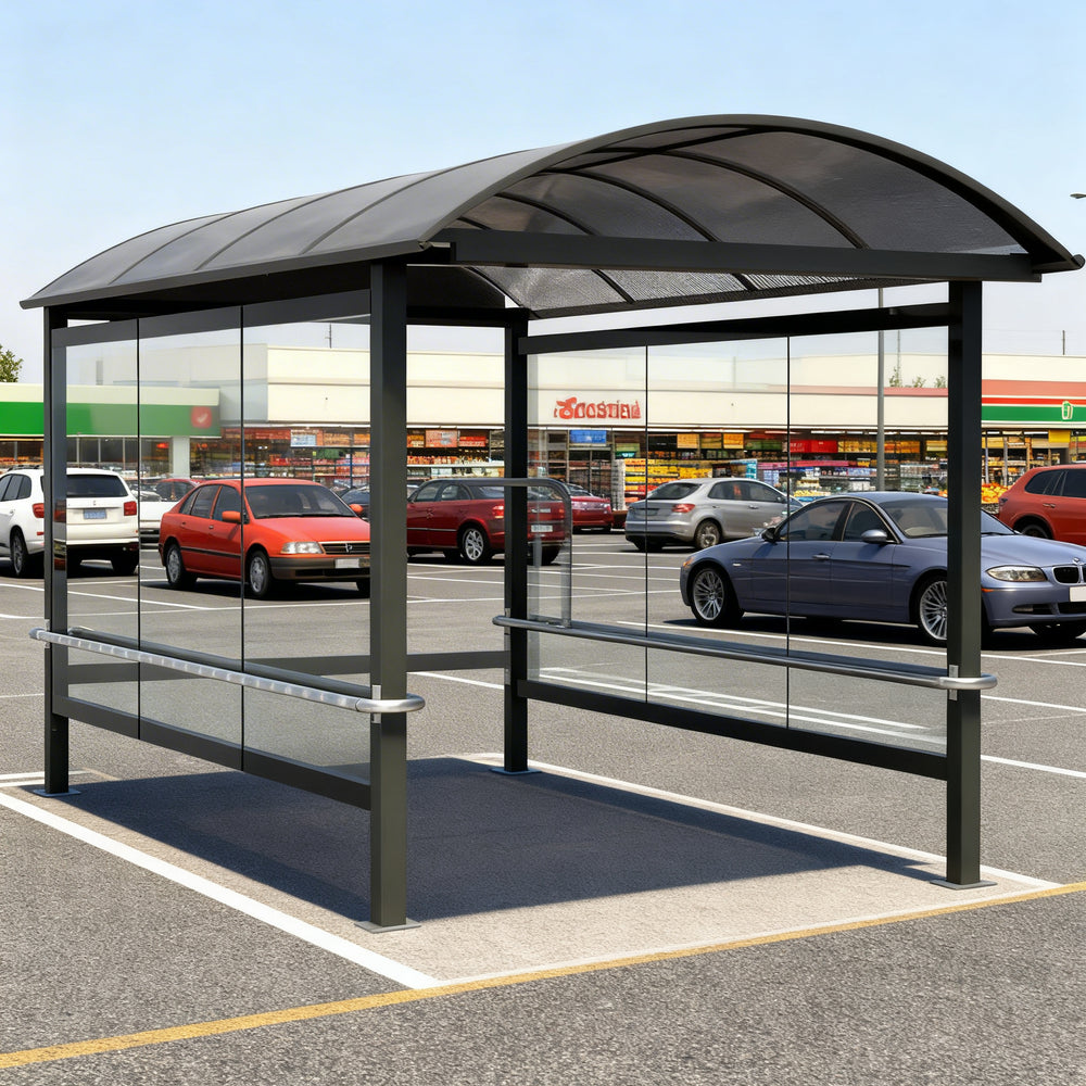 Empty modern shopping cart shelter with curved translucent roof and glass enclosure designed for grocery and retail stores.