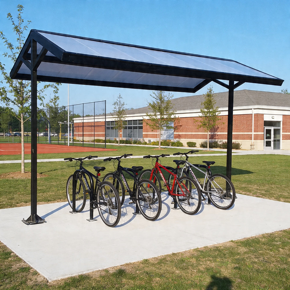 Bicycle shelter with multiple bicycles parked underneath in an outdoor setting.