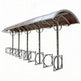 TAIMCO covered bike parking shelter with curved roof and integrated steel bike racks.