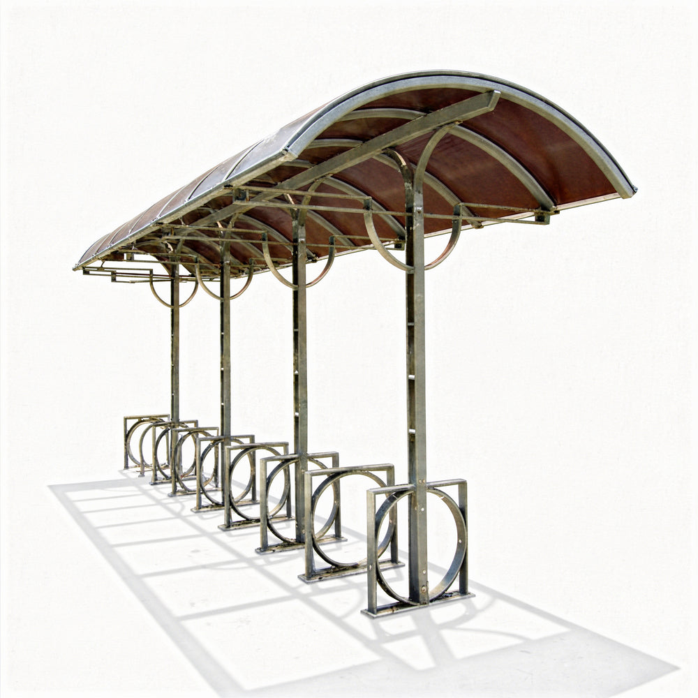 Close‑up of curved metal roof on TAIMCO bike shelter showing weather‑resistant construction.