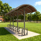 Bicycle shelter with a curved roof in a park setting