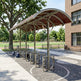 Bicycle parking area with a shelter on a campus or park setting