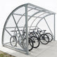 Bicycle shelter with multiple bicycles inside on a white background