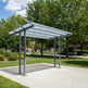Covered outdoor area with a transparent roof in a park setting