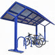 Blue bicycle shelter with multiple bike racks on a white background