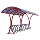 Red bicycle parking shelter with multiple bike racks on a white background