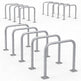 Set of stainless steel bike racks on a white background