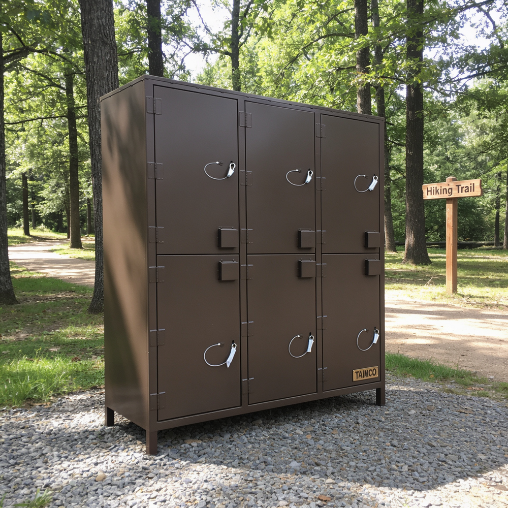 Brown metal locker with multiple doors in a park setting