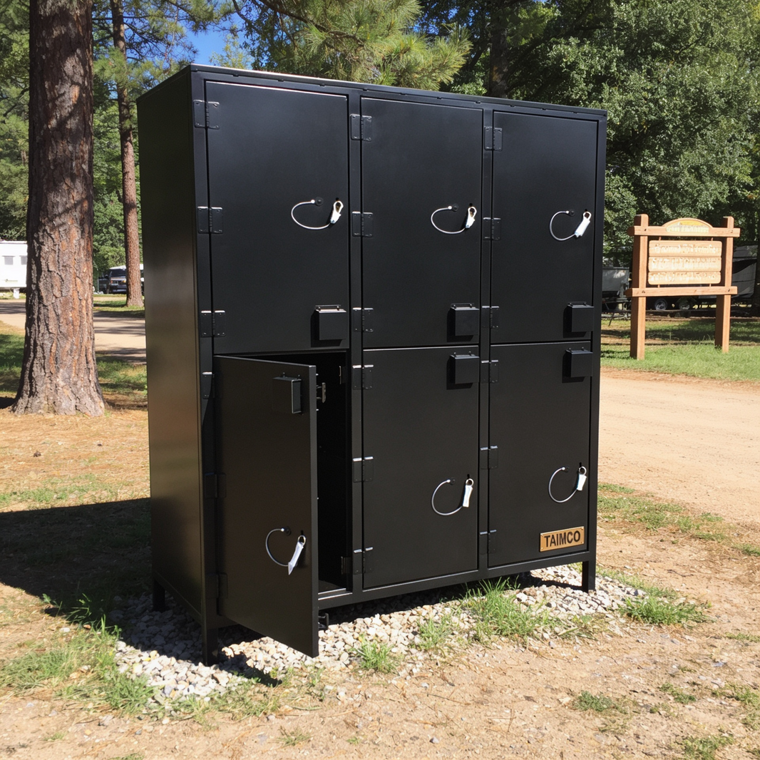 Black metal locker unit with open door in a park setting
